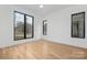 Light-filled bedroom with hardwood floors and large windows at 308 Dover Ave, Charlotte, NC 28209