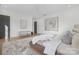 Elegant bedroom featuring a neutral color palette, plush bedding, and ample natural light at 308 Dover Ave, Charlotte, NC 28209