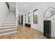 Spacious entryway with hardwood floors, staircase, and natural light at 308 Dover Ave, Charlotte, NC 28209