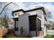 Modern home with gray brick accents, screened porch, and landscaped yard at 308 Dover Ave, Charlotte, NC 28209