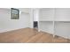 Large walk-in closet with ample shelving and hanging space at 308 Dover Ave, Charlotte, NC 28209