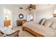 Bright bedroom featuring a wooden bed frame and access to a full bathroom at 3101 Elmwood Dr, Monroe, NC 28110