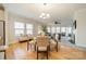 Bright dining room with hardwood floors and seating for four at 3101 Elmwood Dr, Monroe, NC 28110