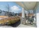 Relaxing front porch with rocking chairs and stone pillars at 3101 Elmwood Dr, Monroe, NC 28110