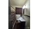 Clean bathroom with shower/tub, vanity, and dark brown accents at 3103 Minnesota Rd, Charlotte, NC 28208