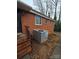 Brick home exterior showcasing AC unit and steps at 3103 Minnesota Rd, Charlotte, NC 28208