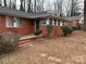 Brick ranch home with front porch and landscaping at 3103 Minnesota Rd, Charlotte, NC 28208