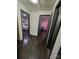 Long hallway with dark hardwood floors and access to bedrooms at 3103 Minnesota Rd, Charlotte, NC 28208