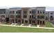 Brick townhouses with modern design, spacious lawn, and ample parking at 3608 Masonboro St # A, Charlotte, NC 28206