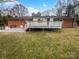 Large backyard with deck and patio area at 4616 Whispering Oaks Dr, Charlotte, NC 28213