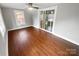 Spacious Gathering room featuring hardwood floors and sliding glass doors at 4616 Whispering Oaks Dr, Charlotte, NC 28213