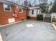 Large concrete patio area adjacent to the house at 4616 Whispering Oaks Dr, Charlotte, NC 28213