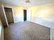 Spacious bedroom with carpeted floors and ample closet space at 4663 Old Lantern Way, Charlotte, NC 28212