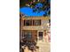 Two-story brick townhouse, featuring red shutters and a walkway at 4663 Old Lantern Way, Charlotte, NC 28212