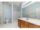 Bathroom with light blue walls, tub, and wooden vanity at 4907 Foxbriar Trl, Charlotte, NC 28269