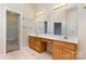 Double vanity bathroom with a large mirror and walk-in closet at 4907 Foxbriar Trl, Charlotte, NC 28269