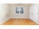 Well-lit bedroom with hardwood floors and double door closet at 4907 Foxbriar Trl, Charlotte, NC 28269