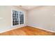 Bright bedroom with hardwood floors and large window at 4907 Foxbriar Trl, Charlotte, NC 28269