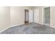 Bedroom with grey carpet and access to a bathroom at 4907 Foxbriar Trl, Charlotte, NC 28269