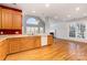 Kitchen features wood cabinets and white appliances at 4907 Foxbriar Trl, Charlotte, NC 28269