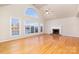 Living room features hardwood floors, fireplace and lake view at 4907 Foxbriar Trl, Charlotte, NC 28269