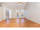 Spacious main bedroom with hardwood floors and backyard access at 4907 Foxbriar Trl, Charlotte, NC 28269