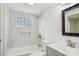 Updated bathroom with marble tile, a bathtub, and modern vanity at 503 Birch St, Lowell, NC 28098