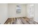 Bedroom with view of bathroom and wood-look vinyl flooring at 503 Birch St, Lowell, NC 28098