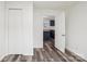 Bedroom with door to kitchen and wood-look vinyl flooring at 503 Birch St, Lowell, NC 28098