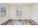 Bright bedroom with wood-look floors and window coverings at 503 Birch St, Lowell, NC 28098