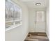 Bright entryway with wood-look vinyl flooring, a window, and neutral walls at 503 Birch St, Lowell, NC 28098