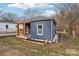 Side view of a charming renovated home with a fenced yard at 503 Birch St, Lowell, NC 28098