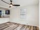 Bright living room with hardwood floors and ceiling fan at 503 Birch St, Lowell, NC 28098