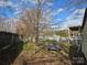 Peaceful backyard pond with a wooden fence and trees at 535 Springs East Rd, Lincolnton, NC 28092