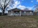 Ranch home with covered porch and stone accents at 535 Springs East Rd, Lincolnton, NC 28092