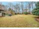 Large backyard with mature trees and grass at 535 Tyson St, Charlotte, NC 28209