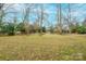 Expansive backyard with wooded backdrop at 535 Tyson St, Charlotte, NC 28209