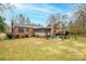 Large backyard with patio, grill, and shed at 535 Tyson St, Charlotte, NC 28209