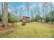 Backyard shed nestled in wooded area at 535 Tyson St, Charlotte, NC 28209