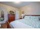 Bedroom with a wooden dresser and a seashell bedding at 535 Tyson St, Charlotte, NC 28209