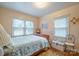 Bedroom with a seashell-themed bedspread and two windows at 535 Tyson St, Charlotte, NC 28209