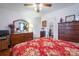 Bedroom with red floral bedding and two dressers at 535 Tyson St, Charlotte, NC 28209