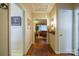 Bright hallway with hardwood floors and view of living room at 535 Tyson St, Charlotte, NC 28209