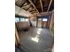 Unfinished attic bedroom with sloped ceilings and wood floors at 543 Salisbury St, Wadesboro, NC 28170