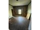 Unfinished bedroom with hardwood floors and window at 543 Salisbury St, Wadesboro, NC 28170