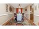 Dining room with dark wood table, neutral chairs, and tasteful decor at 5767 Dove Point Dr, Concord, NC 28025