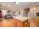 Open kitchen with island and hardwood floors at 5767 Dove Point Dr, Concord, NC 28025