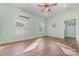 Bright bedroom with wood flooring, multiple windows, and AC unit at 6 Walnut St, Great Falls, SC 29055