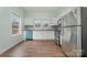 Modern kitchen with white cabinets and stainless steel appliances at 6 Walnut St, Great Falls, SC 29055