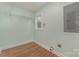 Laundry room with wire shelving, window, and electrical panel at 6 Walnut St, Great Falls, SC 29055